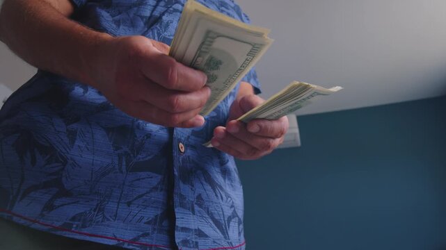 Hands skillfully separate crisp bills in a cheerful setting, reflecting a moment of anticipation and hope, showcasing the joy of financial success