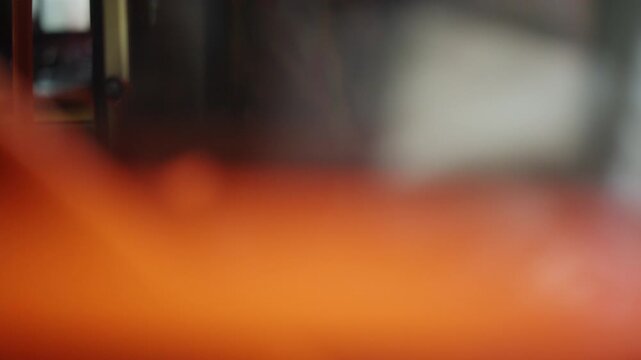 Soft focus interior view of a passenger sitting inside a public transportation vehicle