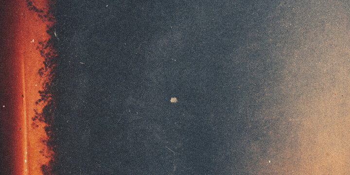 Corroded metal surface with rust and textured dark background