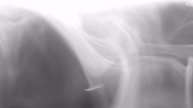 Realistic dry ice smoke clouds fog overlay smoke slowly floating through space against black background White smoke on black background in motion 4k