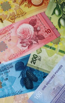 Syrian pound money banknotes bunch on table. Syria bills of SYP currency close up