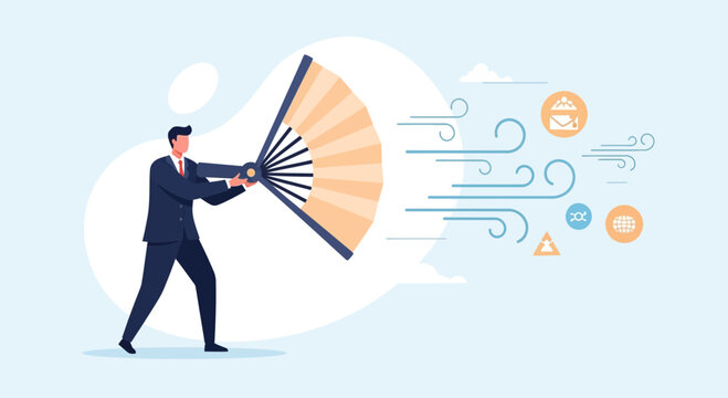 Businessman using a large fan to create a wind of ideas and solutions, symbolizing innovation and problem-solving
