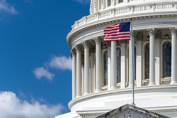 Naklejka premium American Flag Flying In Front Of United States Capitol Dome Architecture