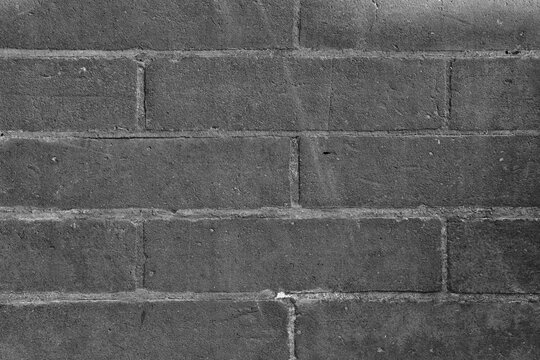 Mur de briques minimaliste en noir et blanc
