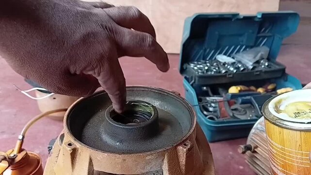 Applying Thick Epoxy Adhesive Inside Worn Front Endshield Housing As A Low Cost Temporary Bearing Fit Repair
