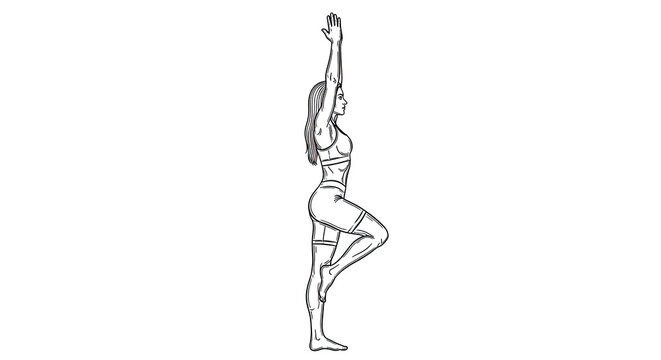 A woman performs a standing tree pose in yoga. She is standing on one leg with her arms raised overhead, maintaining balance and focus.
