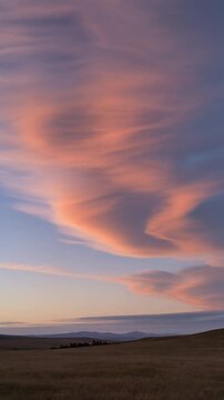 Dramatic Pink Clouds at Sunset over Rolling Hills Generative AI