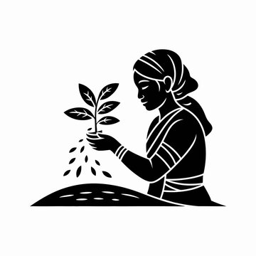 Black silhouette of a woman planting a young sapling