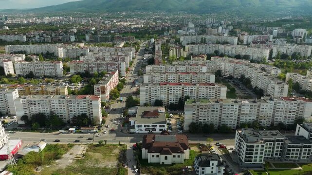 Aerial drone flyover of Obelya district in Sofia, Bulgaria, cinematic overhead view of residential apartment buildings.