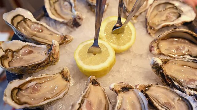 Fresh oysters displayed on crushed ice with sliced lemons in a seafood restaurant setting