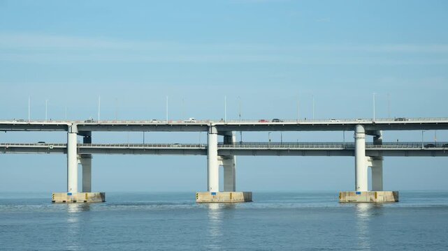 Daytime Timelapse of a Two-Level Section of Gwangan Bridge with Traffic Against Blue Sky