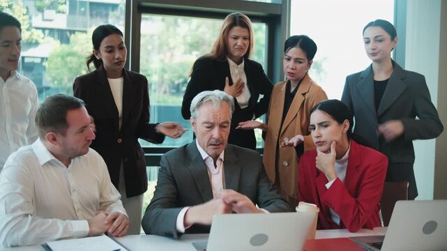 White male senior CEO anxious and tense about company incomes and stock trading investment results on a laptop with multiracial partner team, chaos, and focus on online conference, business meeting.