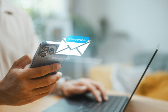 User subscribing to a digital newsletter on a smartphone with email notification interface and call-to-action button. Represents email marketing, lead generation, customer engagement.