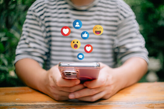 Distancing ,Working From Home concept.The concept of living on vacation and playing social media. Social media and digital online concept, man using smart phone with Social media. Social Distancing .