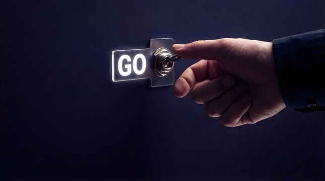 A hand flips a metal toggle switch labeled go on a dark panel to initiate a new business project