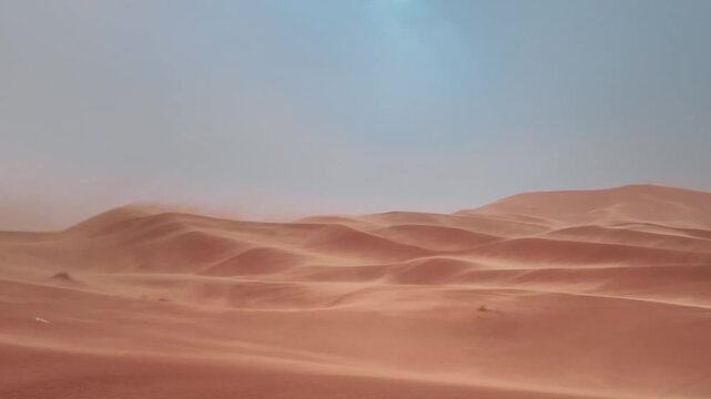 Sandstorm Blowing Over Sahara Desert Dunes in Morocco
