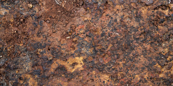 Porous laterite rock surface texture with natural reddish brown color
