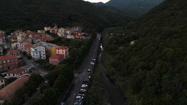 Establishing aerial of Deiva Marina valley and Corbara town during twilight hours