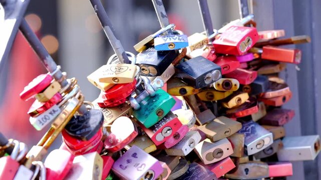 Many love locks on a metal structure in a European city