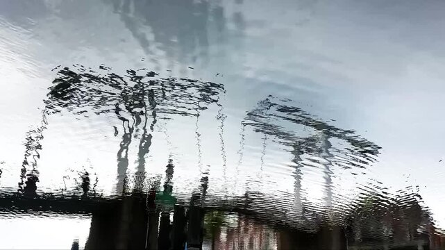 Reflection in the water of the old historic drawbridge Gravenstenenbrug in the center of Haarlem in The Netherlands