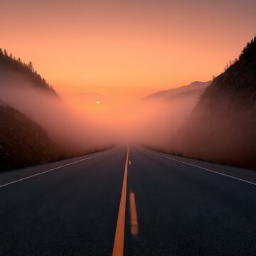 Misty Mountain Road at Sunrise: Atmospheric View of Empty Highway