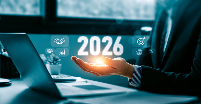 Future business planning 2026 concept with digital financial icons in hand showing target strategy partnership growth investment percentage forecast and corporate goal achievement