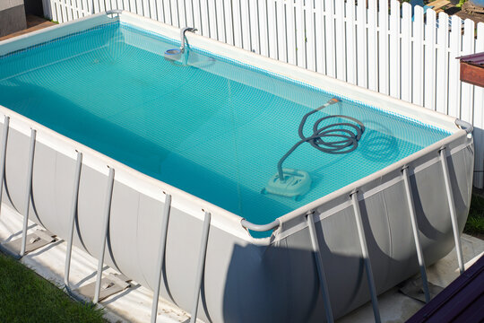 Robotic pool cleaner working underwater to keep swimming pool clean.