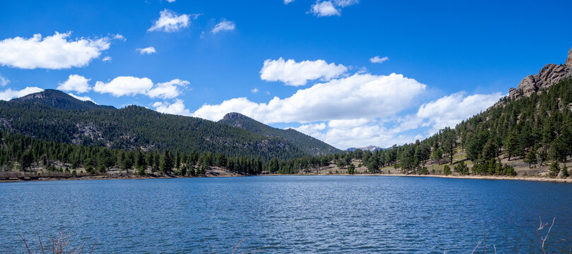 Panoramic view of Lily Lake with pine trees and small mountains backdrop