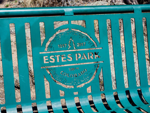 Close up of Estes Park sign on park bench in Rocky Mountains National Park in Colorado, USA