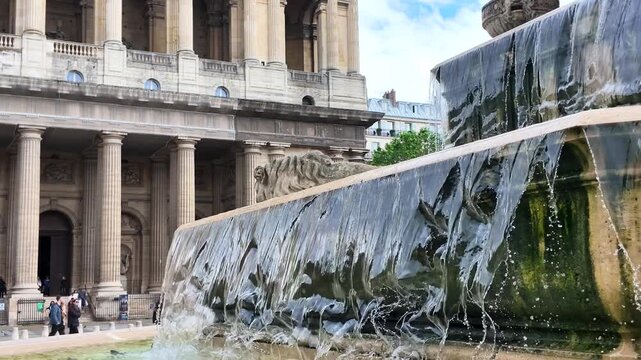 Water Cascading Over Stone Tiers at Saint Sulpice Fountain in Paris