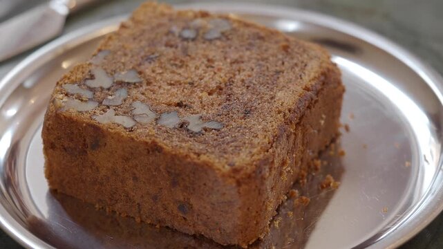 Enjoying fresh cake on a silver plate at a cafe