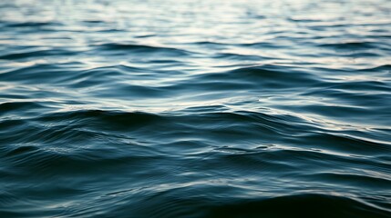 Fototapeta premium A peaceful and smooth water surface reflecting soft natural light creating a tranquil and serene background