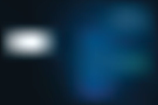 Blurry scene with a white oval object on a dark background next to blue