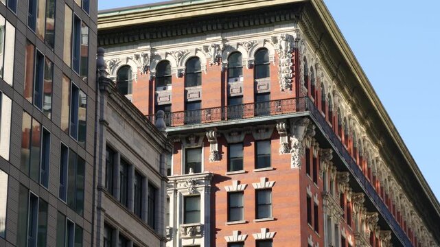 New York City Midtown urban buildings architecture, Manhattan street or avenue, United States of America. Red brick classic house, USA. Typical old historic real estate property in NYC.