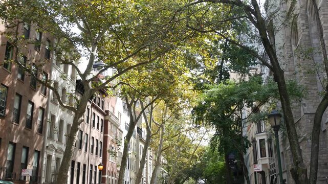 New York City urban residential buildings architecture, Manhattan classic street, Greenwich village, United States of America. Typical red brick house in NYC, real estate property in USA. West village