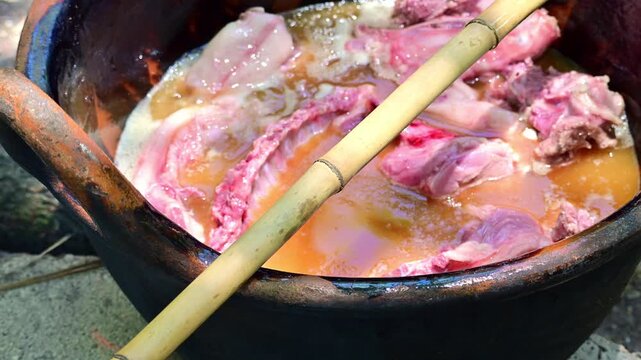 Details of the meat cooking process with lard for carnitas