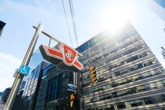 Toronto Canada - May 26 2026: TTC Subway Entrance Sign at King Street West Intersection with Modern Office Buildings