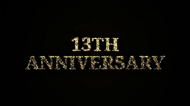Golden sparkling particles forming 13th anniversary text on black background