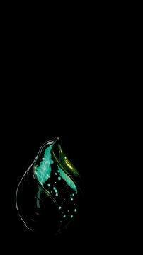 Macro View of a Glowing Emerald Fluid Capsule