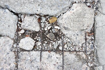 Fototapeta premium Broken and damaged concrete road background
