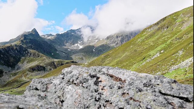 Moving clouds above Suretta massif and Montespluga pass, 4k video footage in the Alps mountains