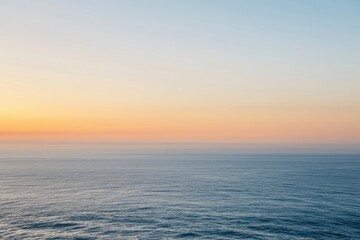 Obraz premium The Ocean at Sunrise with Pastel Sky and Calm Horizon