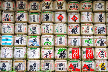 Fototapeta premium Japanese Nihonshu or as it is known outside of Japan, Sake. Barrels are an offering to the gods at Meji shrine in Shinjuku, Tokyo, Japan