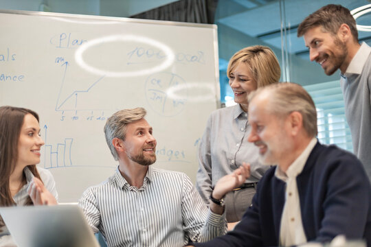 Group of happy progressive business people working on startup together at creative office