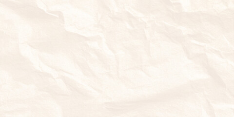 Fototapeta premium Crumpled beige paper texture background with soft folds and creases for design and craft projects
