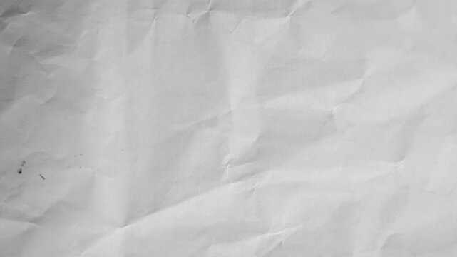 White textured paper background with subtle creases and folds, clean minimalist surface for creative projects and professional backdrops, 4k video.