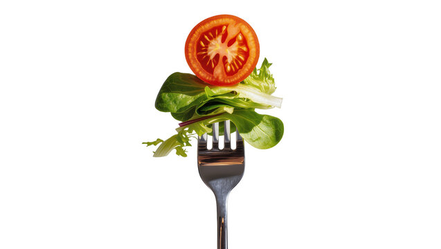 Fresh salad leaves and tomato slice on fork