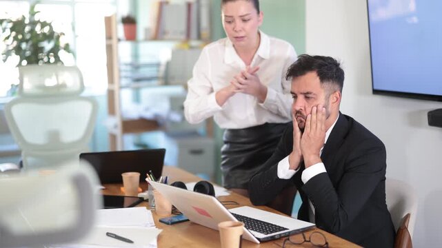 Female manager is dissatisfied with the work of an employee - yells and reproaches her. High quality 4k footage