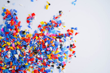 Fototapeta premium Plastic colorful pieces recycling shredded for industrial use.