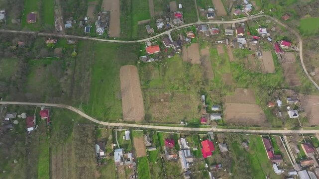Top down aerial view reveals rural farmland mosaic in northeastern Romania